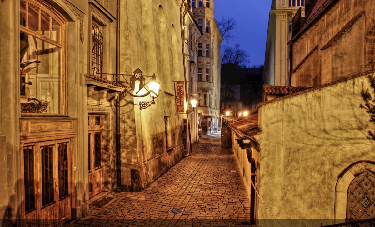 A quiet lamplit alley in Josefov by night, Prague