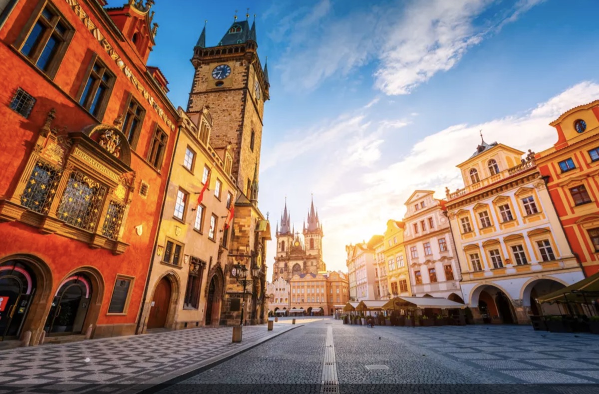 Old Town Square at sunrise, with the Old Town Hall Tower and Týn Church, Prague